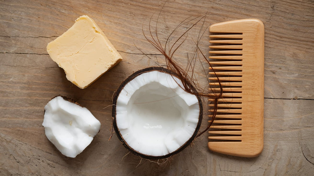 Raw shea butter, coconut oil, and wooden comb, highlighting natural ingredients for hair nourishment.